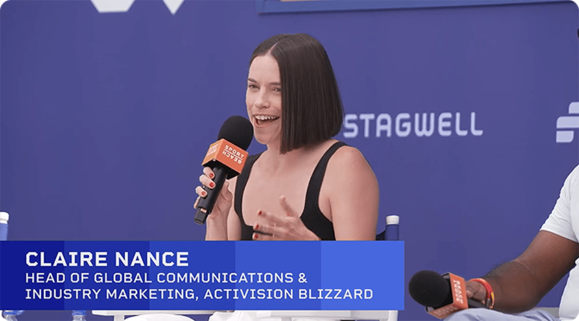Claire Nance speaks into a microphone on the Sport Beach stage in Cannes.