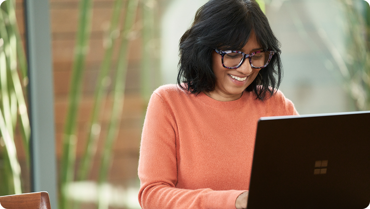 A woman working from home on her laptop.