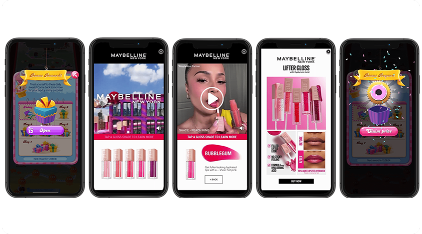 Five phone screens show Maybelline ads with lipstick and gloss products plus colorful game reward pop-ups. 